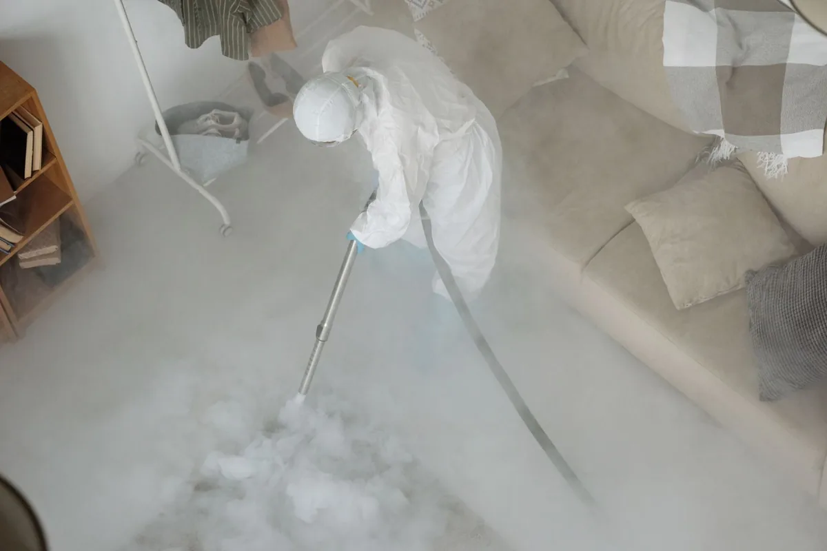 Biohazard cleanup technician in protective equipment, Smith Mills, MA